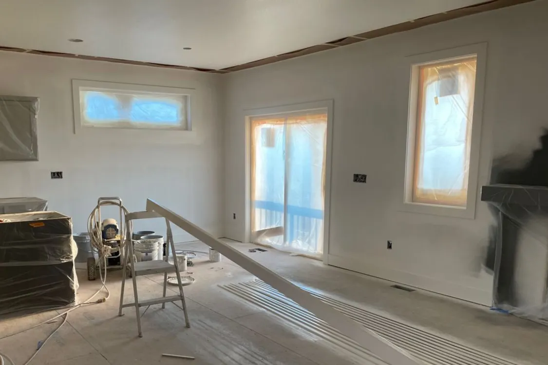 Drywall service progress photo showing wall and ceiling preparation